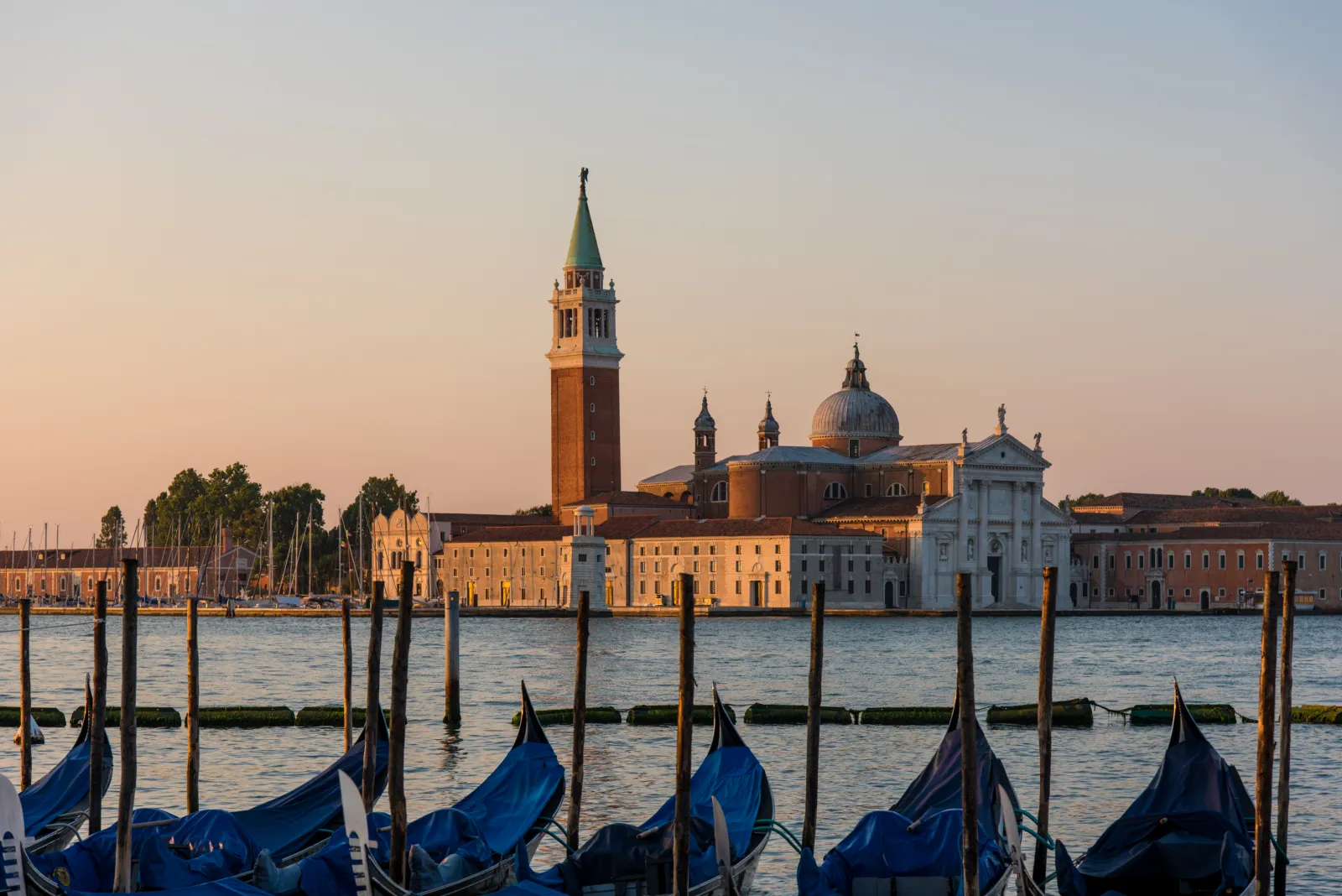 San Giorgio Maggiore at sunset, with gondolas moored in the foreground